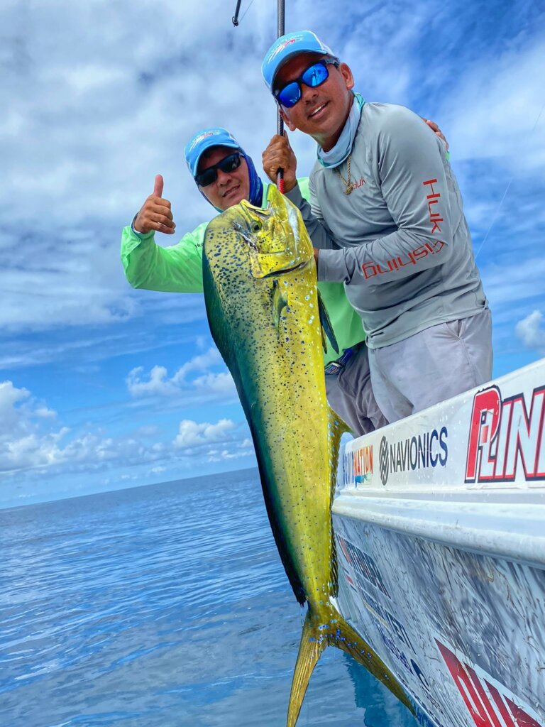 dorado on the side of the boat