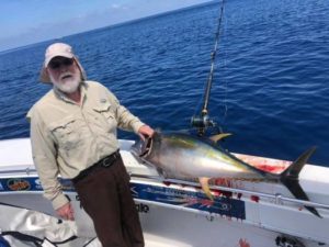 nice yellowfin on the rail of the boat