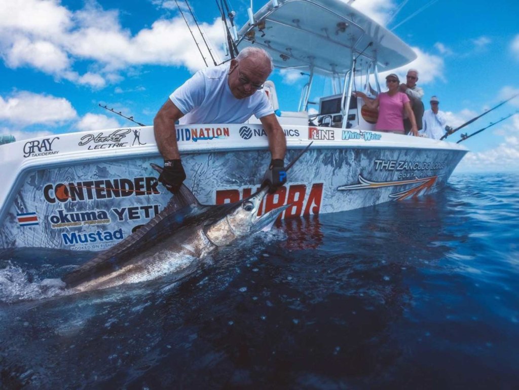 marlin on the side of boat