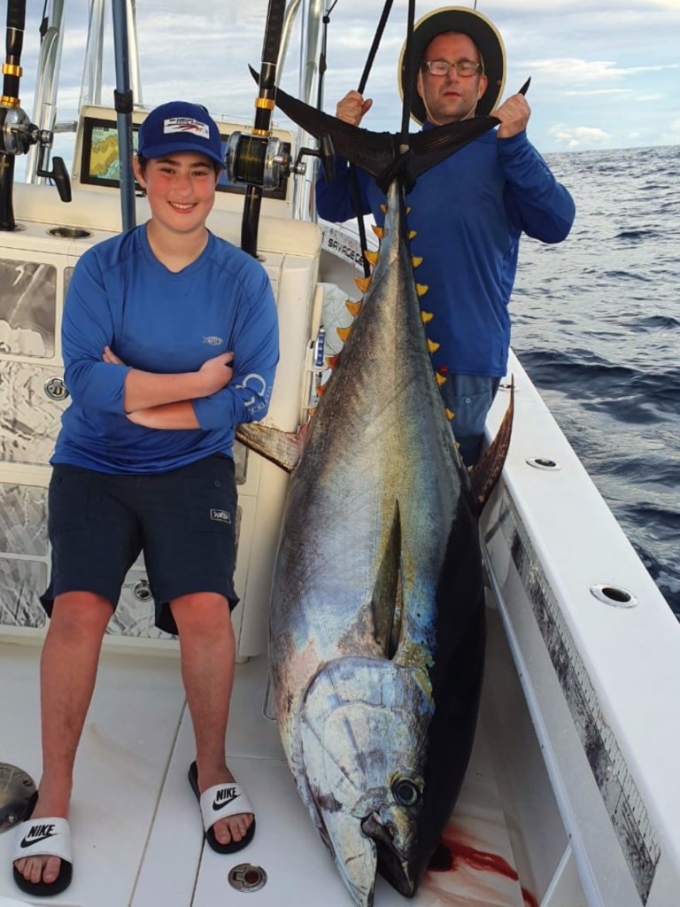 girl catches big tuna