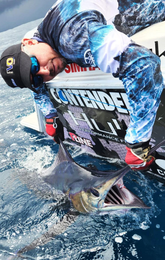 posing with marlin fishing in costa rica