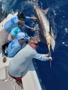 family releasing marlin