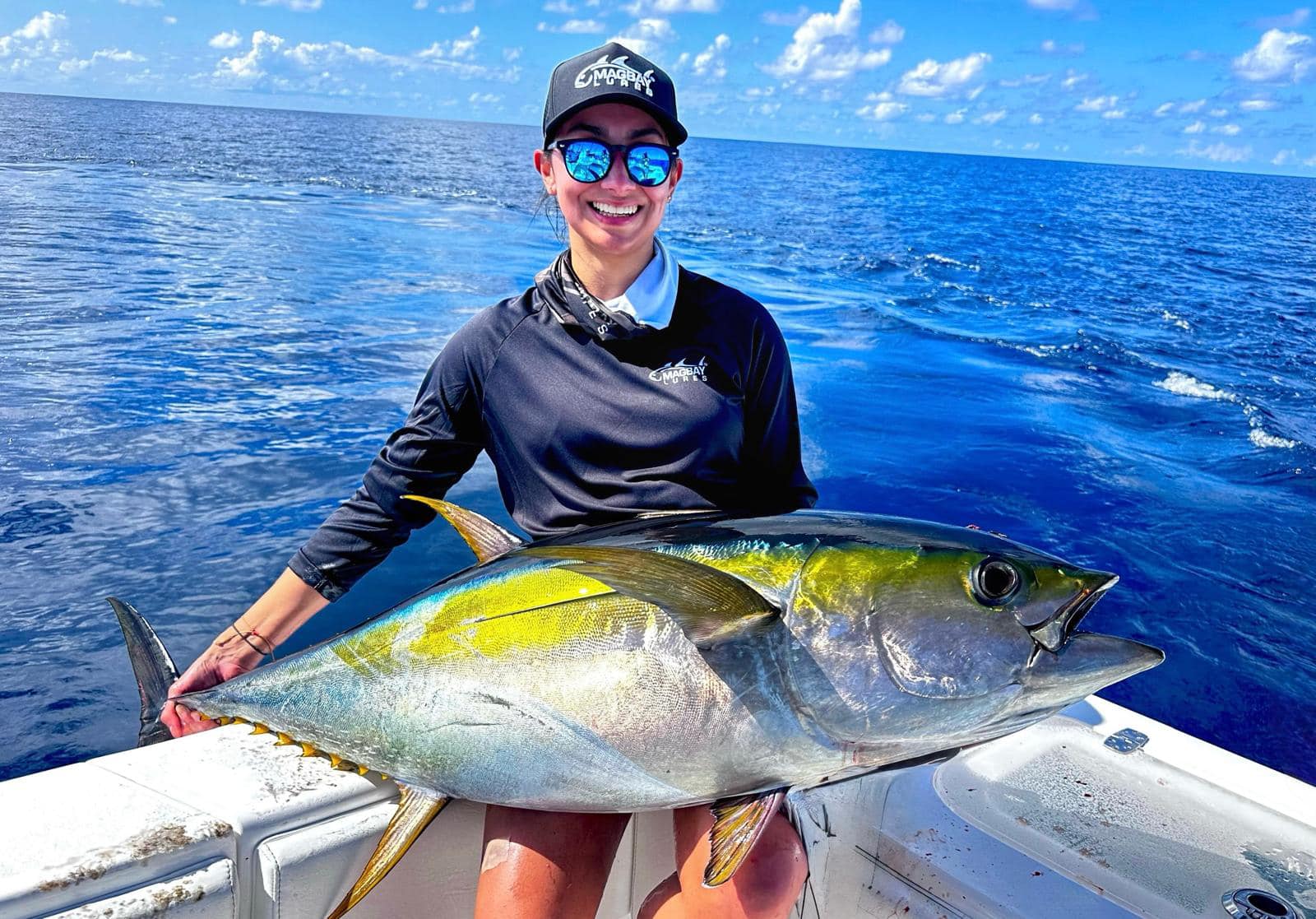 Girl fishing for yellowfin tuna